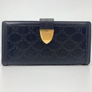 Gucci Long wallet double hook closure black gold leather